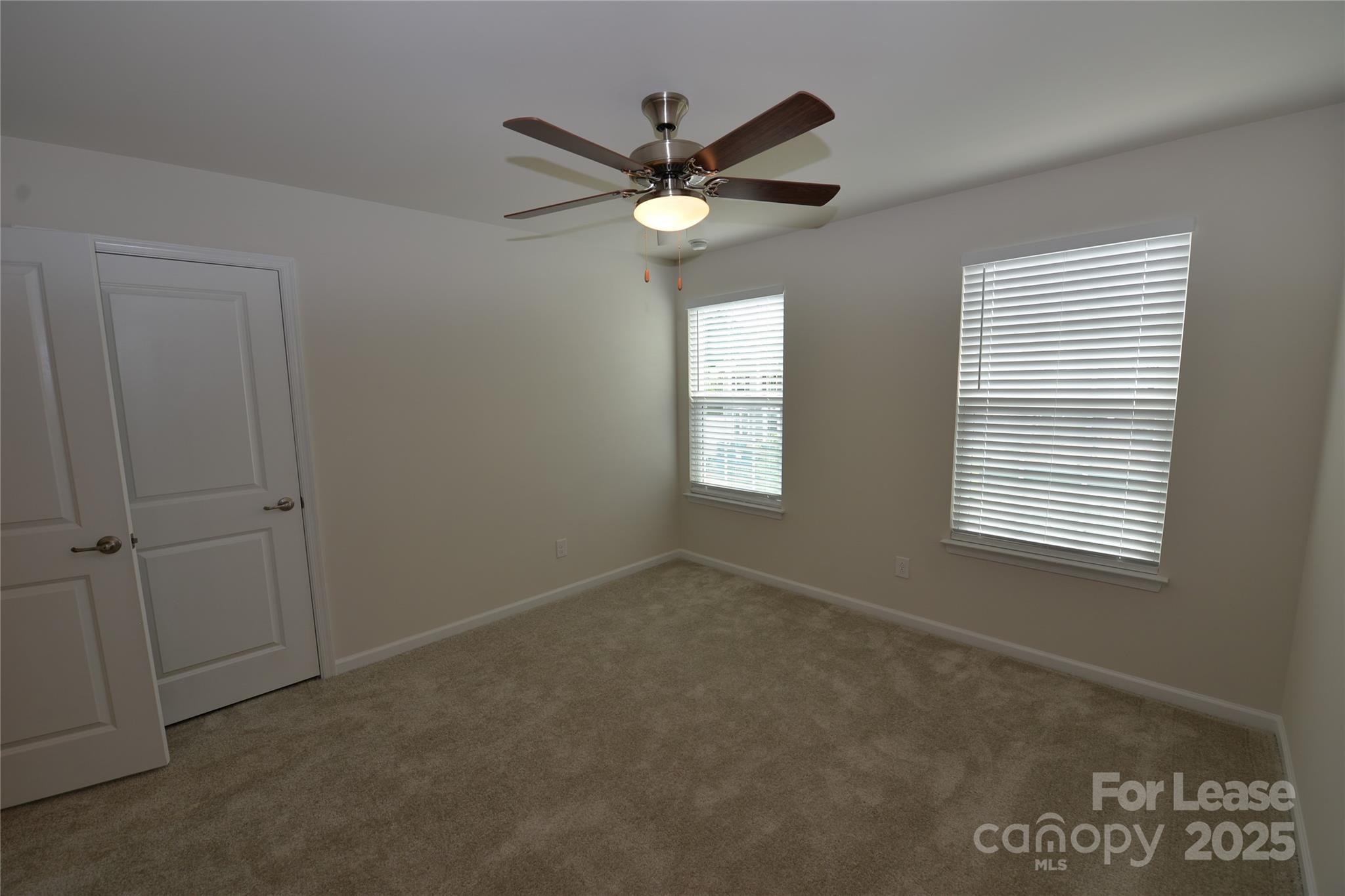 2829 Sand Cove Court Denver, NC 28037 - Photo 22 of 31 a view of a livingroom with a ceiling fan and window