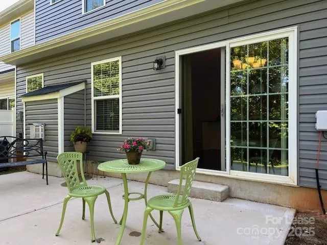 a view of two chairs in patio