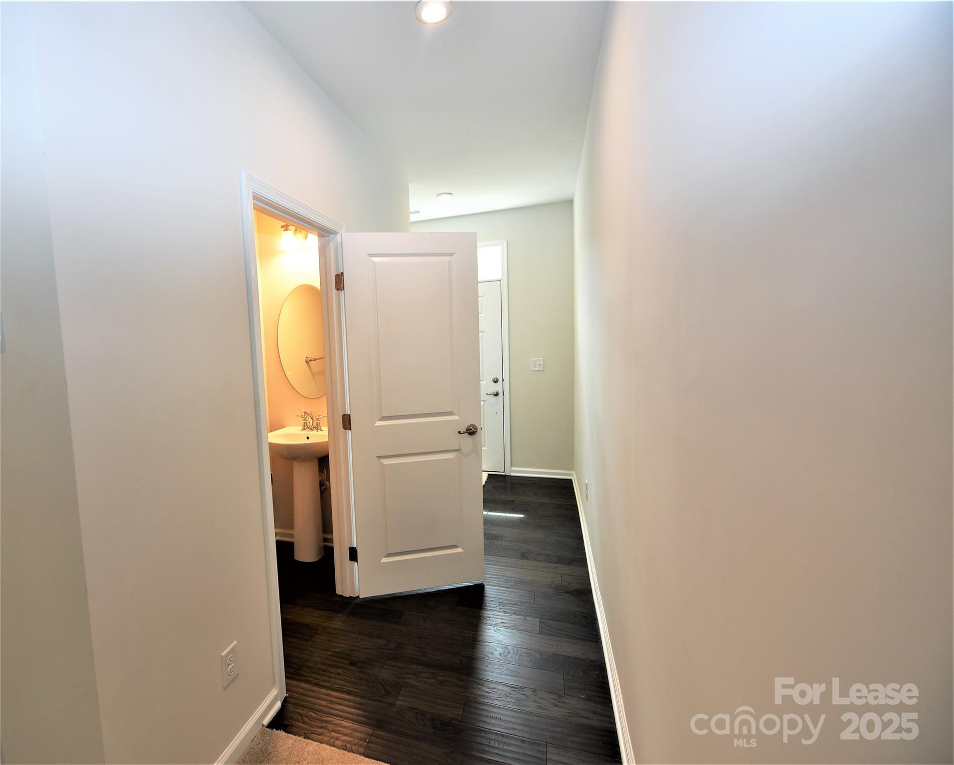 2829 Sand Cove Court Denver, NC 28037 - Photo 5 of 31 a view of a hallway with wooden floor