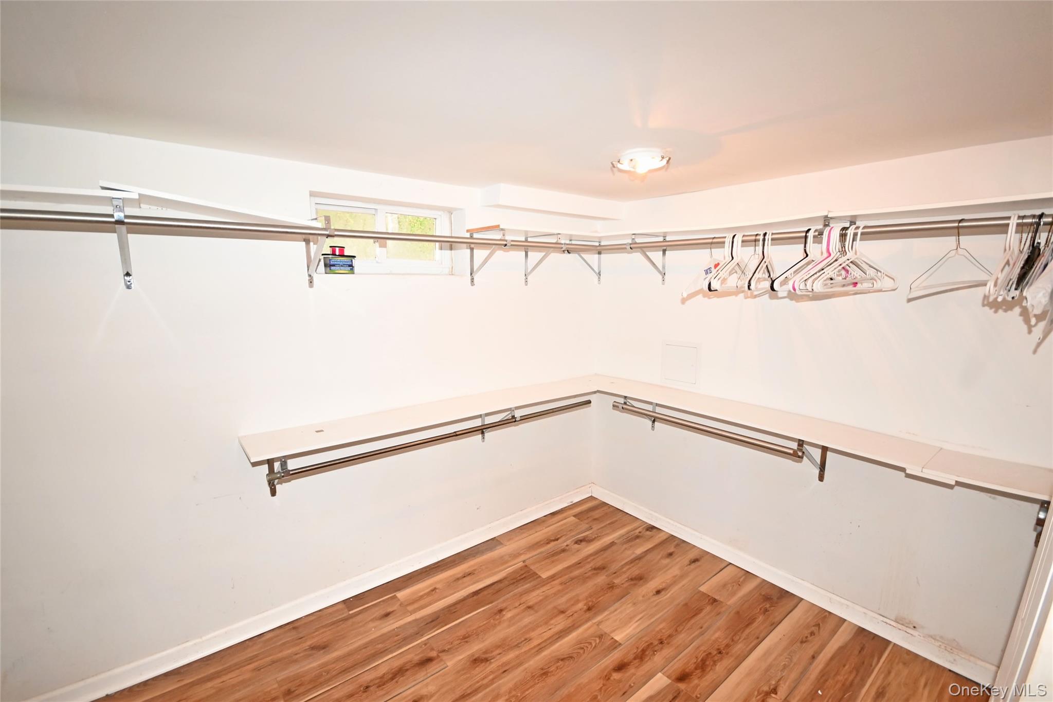 89 Osborne Road West Hempstead, NY 11552 - Photo 49 of 50 Spacious closet with light wood-style flooring