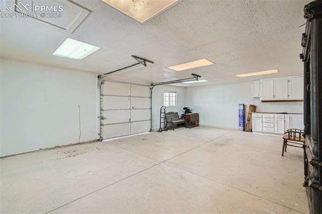 11915 Northcliff Road Elbert, CO 80106 - Photo 27 of 36 View of garage