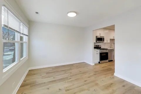 a view of a kitchen with a sink and dishwasher cabinets