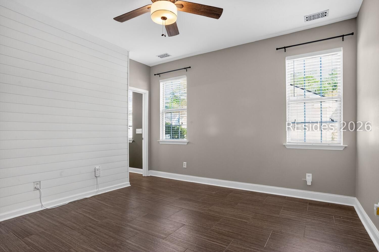 100 9th Avenue Bluffton, SC 29910 - Photo 15 of 45 Primary Bedroom with shiplap wall accent