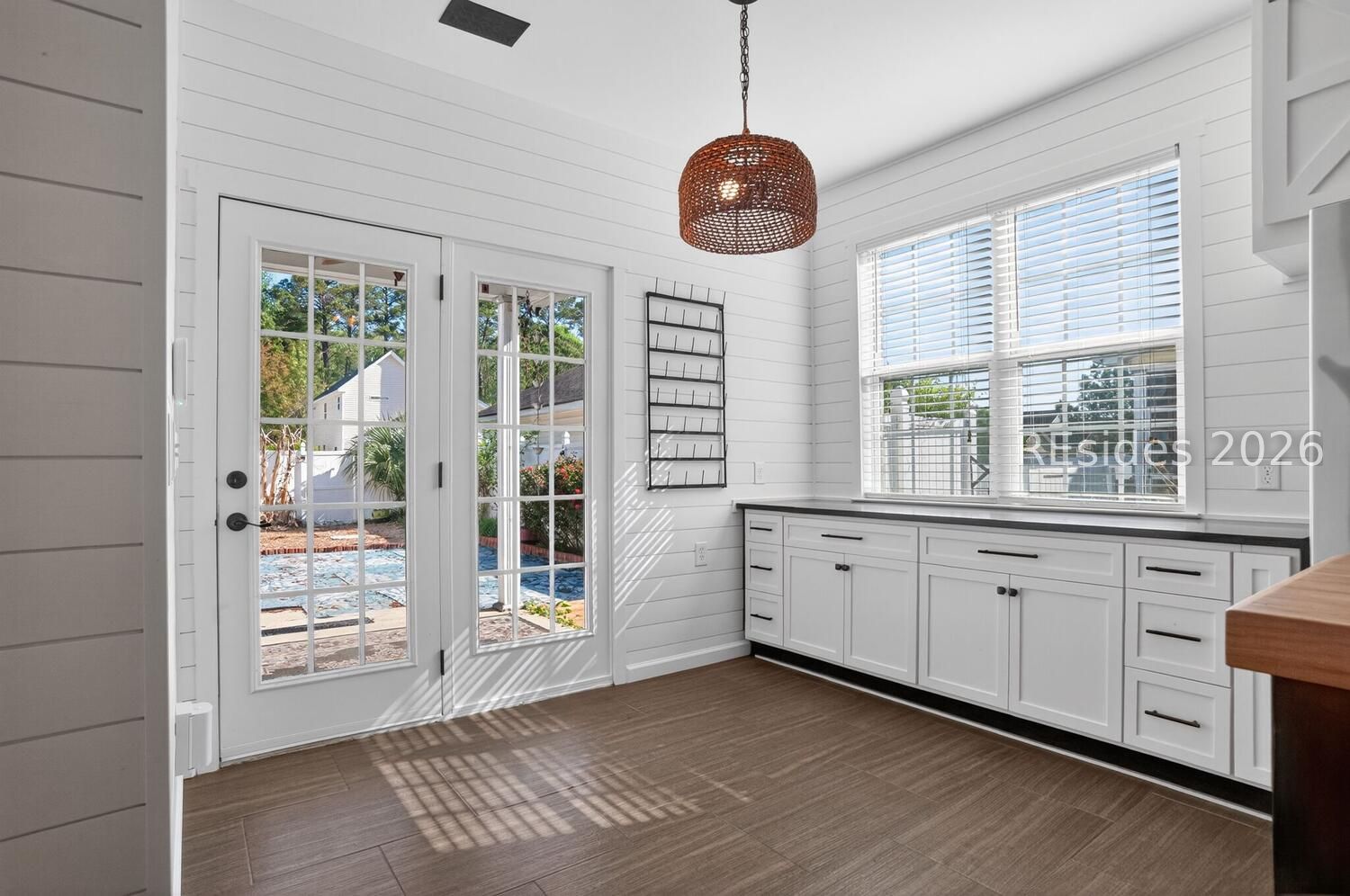 100 9th Avenue Bluffton, SC 29910 - Photo 10 of 45 Glass doors to backyard with extra counterspace
