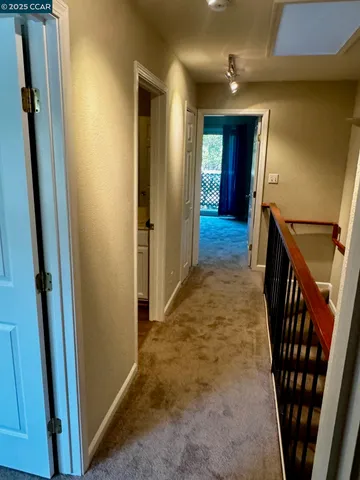 a view of hallway with stairs