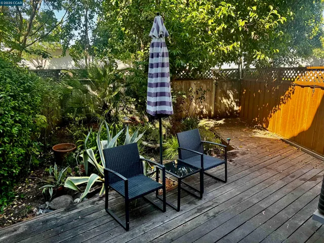 a view of a chairs in wooden deck