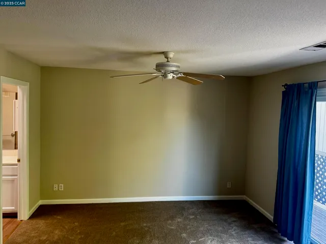 an empty room with a empty space and a window