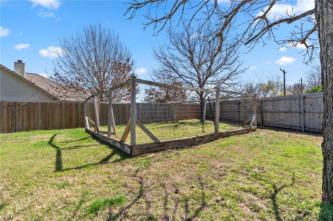 8 Republic Drive Waco, TX 76708 - Photo 12 of 42 a view of backyard with a slide and swing