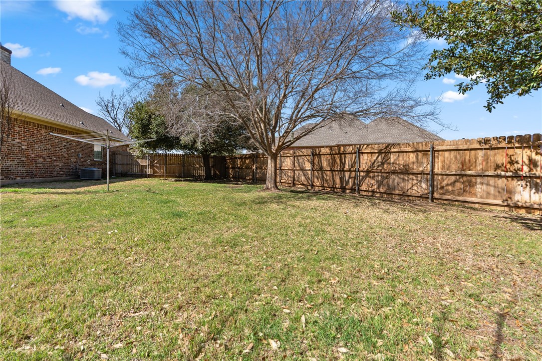 8 Republic Drive Waco, TX 76708 - Photo 15 of 42 a view of a yard with a house