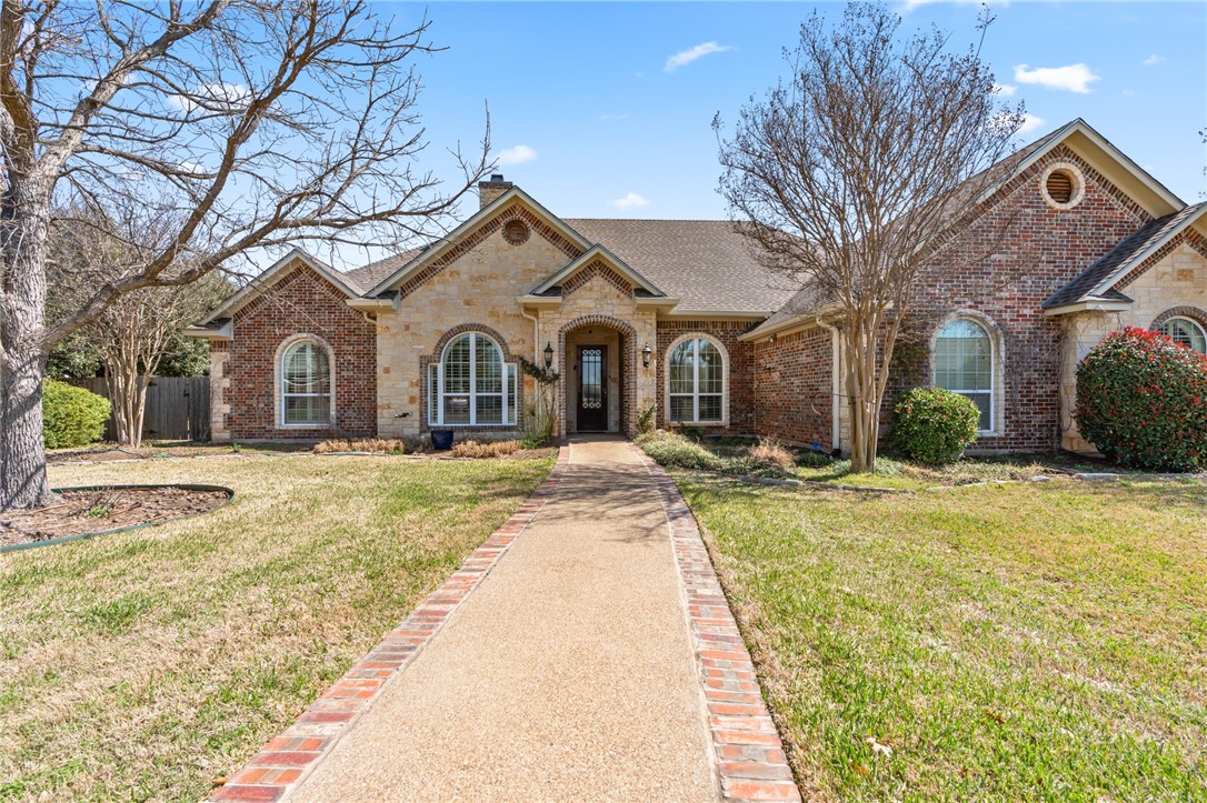 8 Republic Drive Waco, TX 76708 - Photo 3 of 42 a front view of a house with a yard
