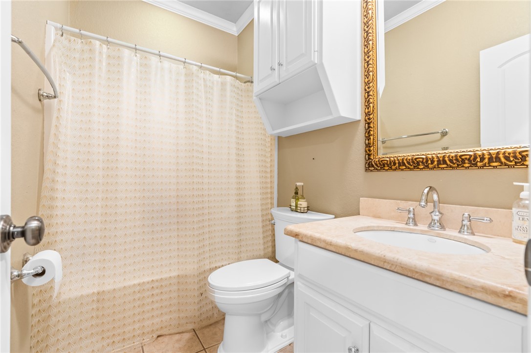 8 Republic Drive Waco, TX 76708 - Photo 37 of 42 a bathroom with a sink a toilet and a mirror