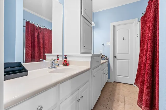 a kitchen with stainless steel appliances granite countertop a refrigerator and a stove