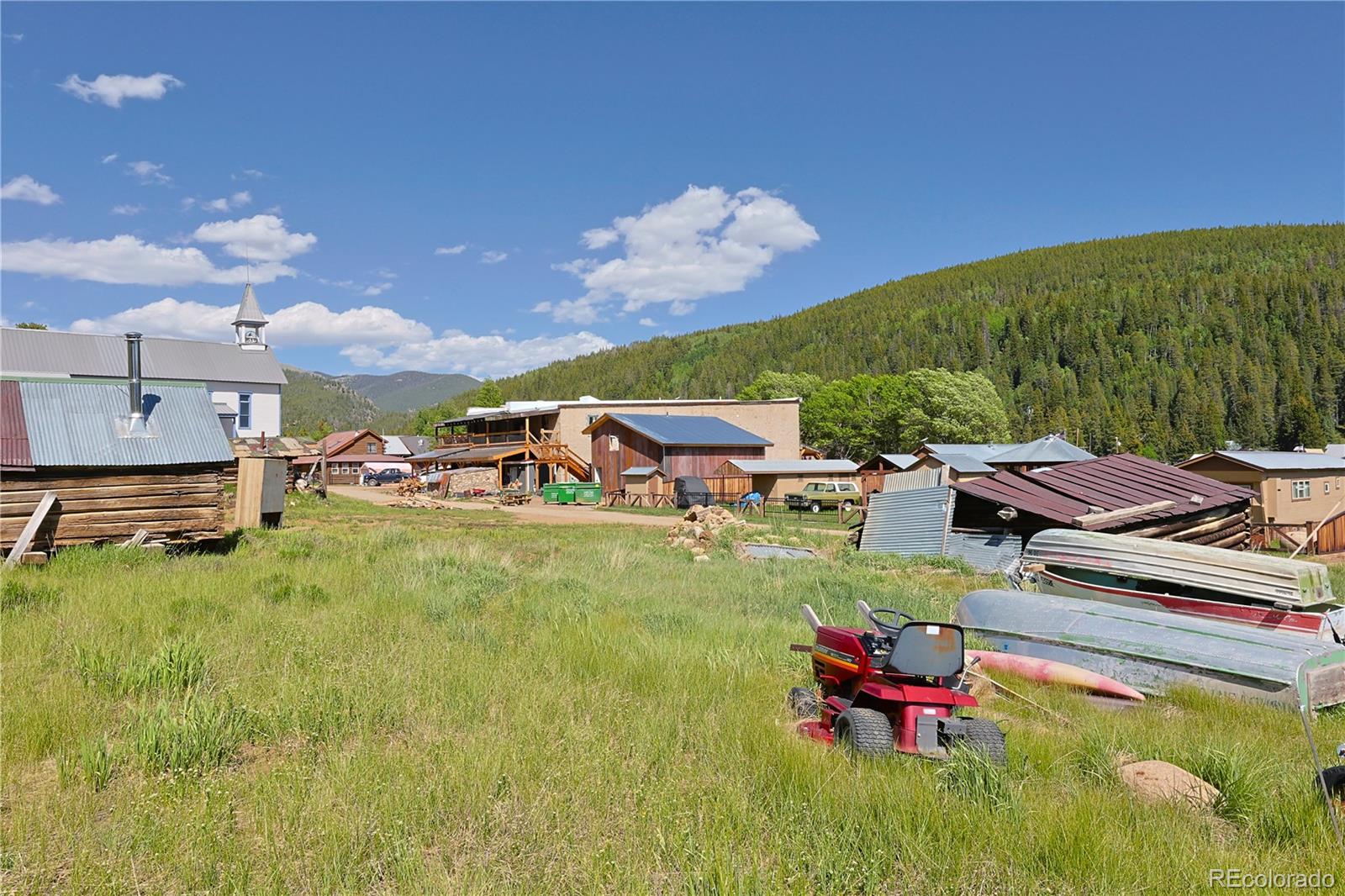101 3rd Street Pitkin, CO 81241 - Photo 11 of 26 a backyard of a house with table and chairs