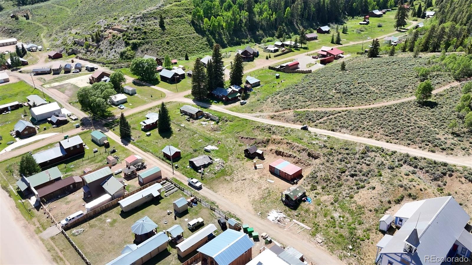 101 3rd Street Pitkin, CO 81241 - Photo 14 of 26 an aerial view of multiple houses with yard