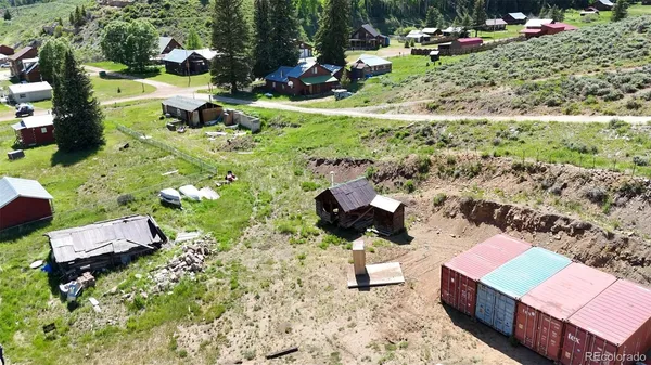 an aerial view of a house with outdoor space