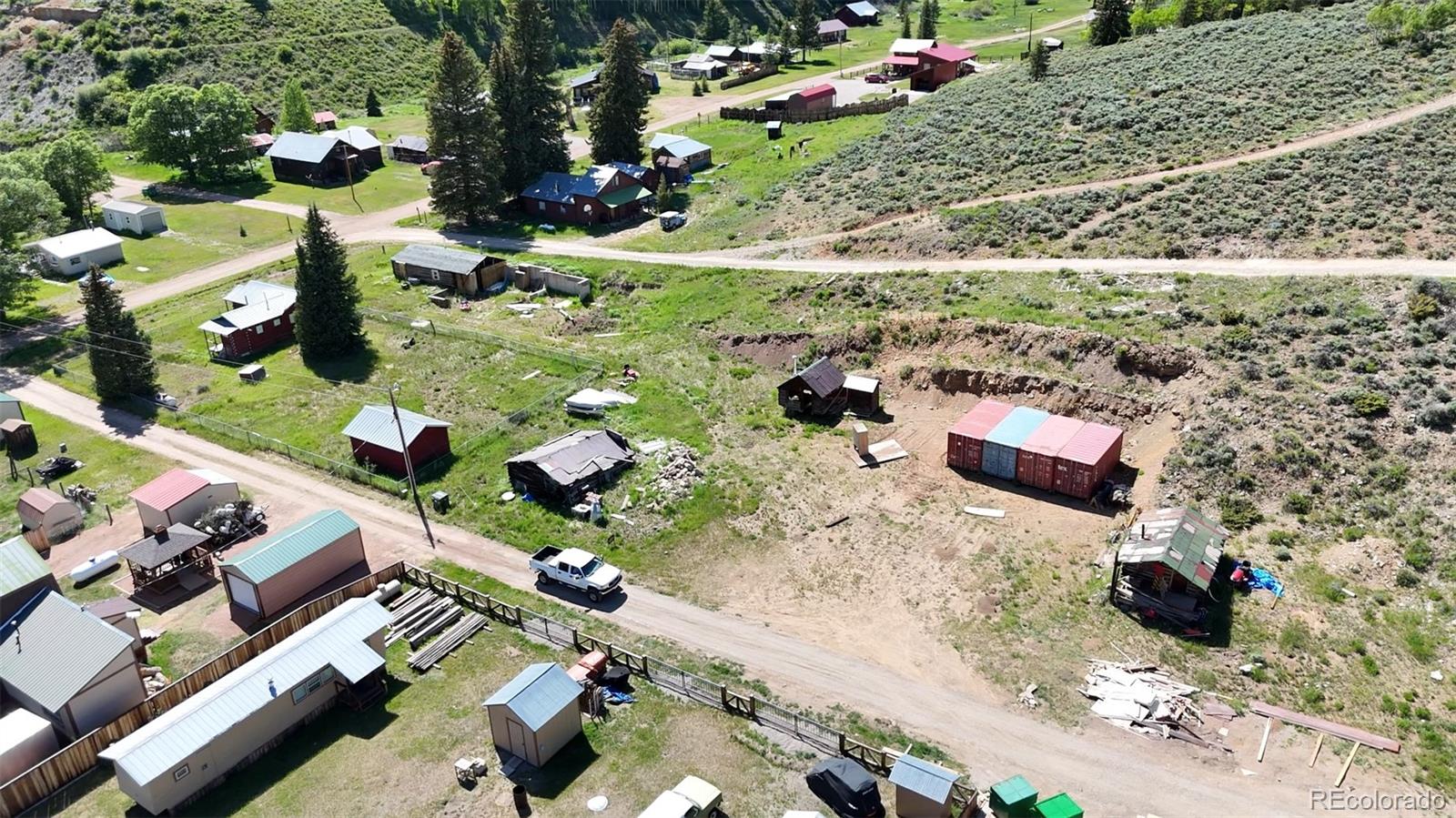 101 3rd Street Pitkin, CO 81241 - Photo 21 of 26 an aerial view of a house with a yard and lake view