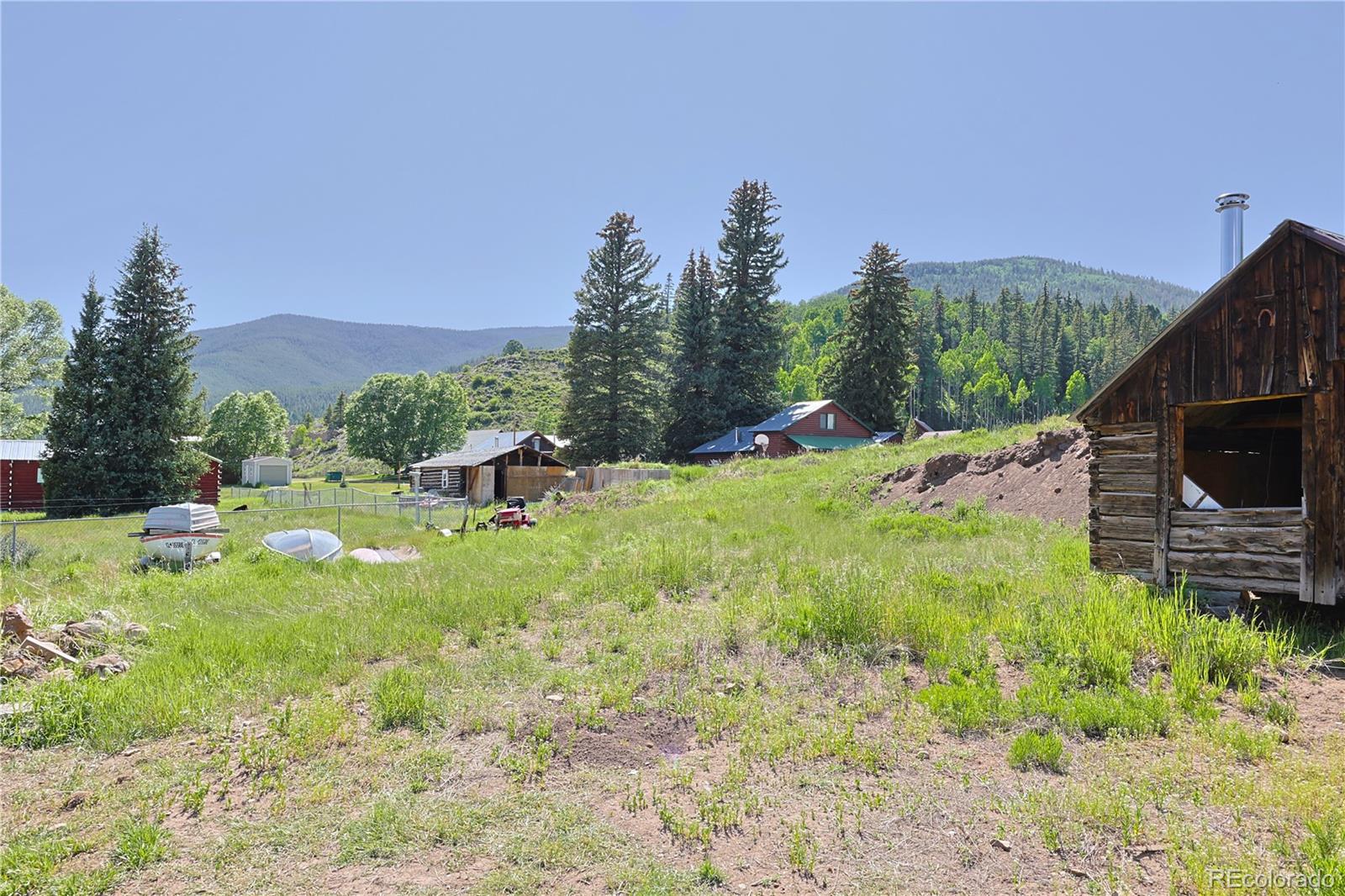 101 3rd Street Pitkin, CO 81241 - Photo 4 of 26 a backyard of a house with table and chairs