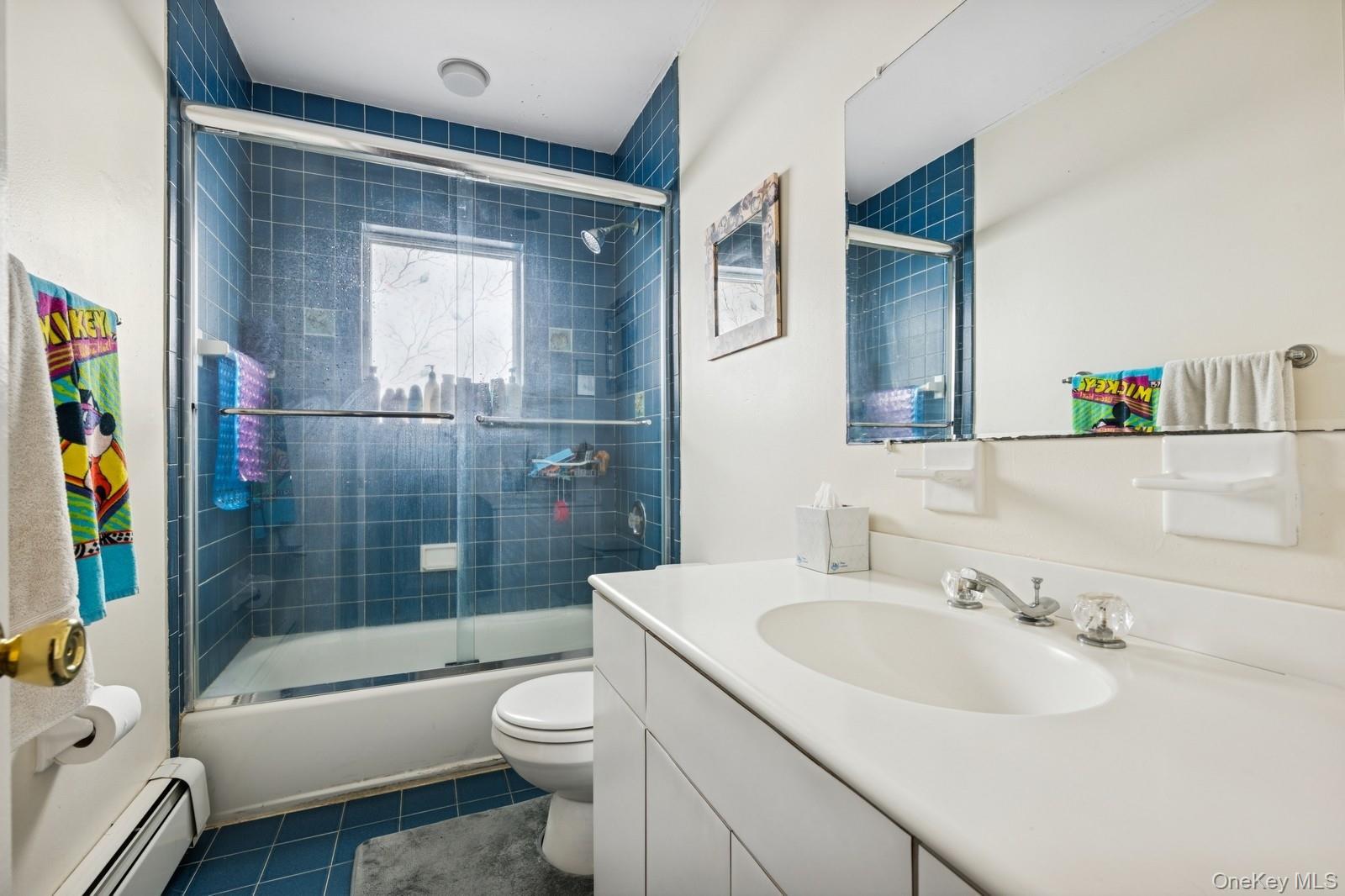 101 Bay Street Long Beach, NY 11561 - Photo 16 of 42 a bathroom with a sink toilet and shower