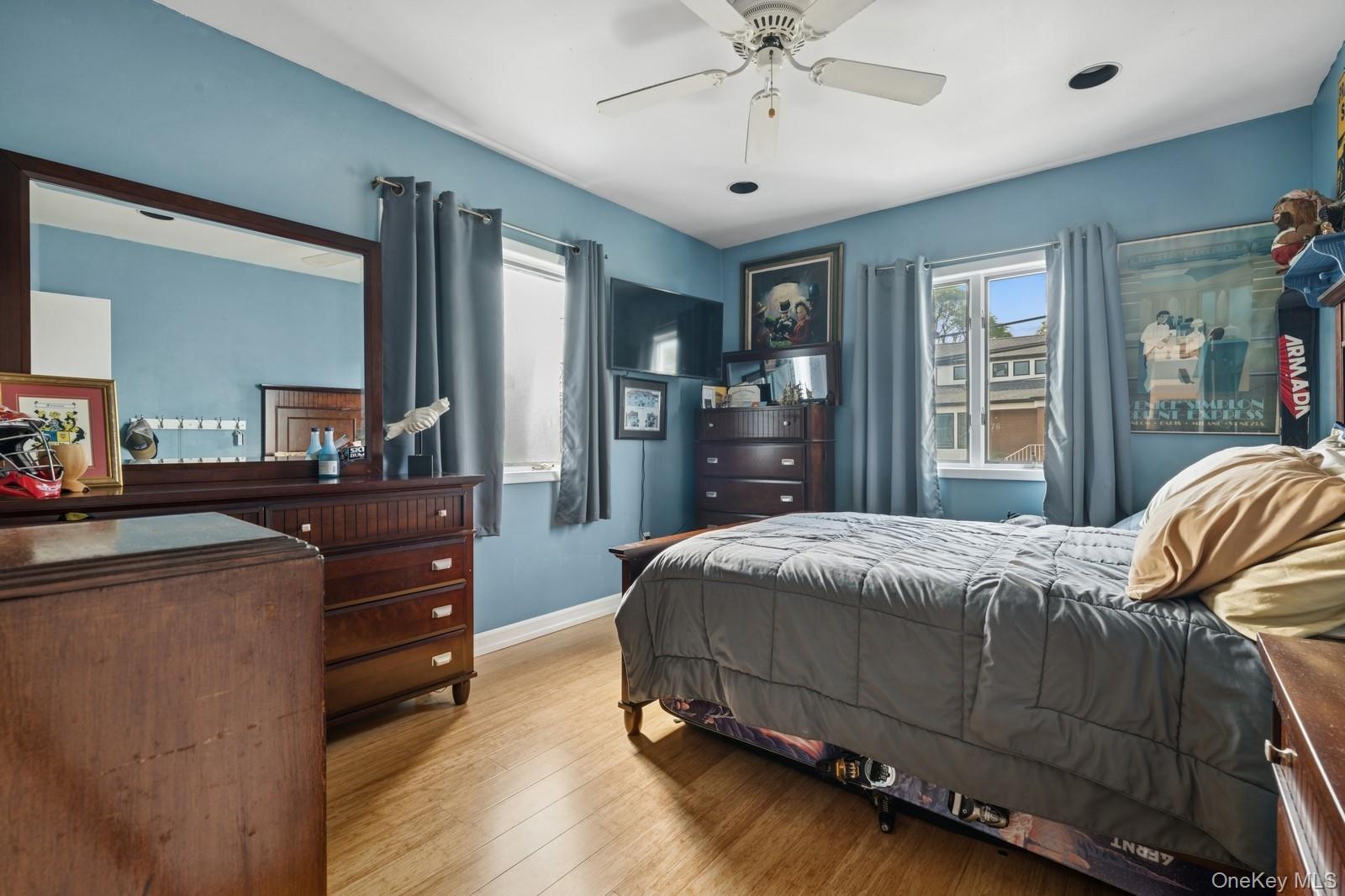 101 Bay Street Long Beach, NY 11561 - Photo 17 of 42 a bedroom with a bed and wooden floor