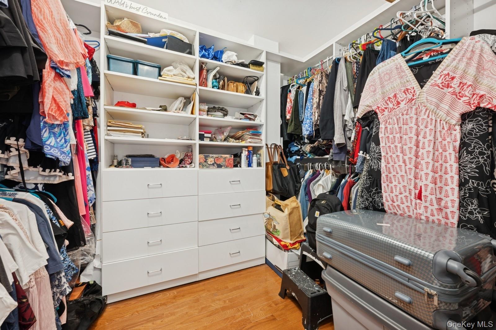 101 Bay Street Long Beach, NY 11561 - Photo 21 of 42 a view of walk in closet with clothes and shoes