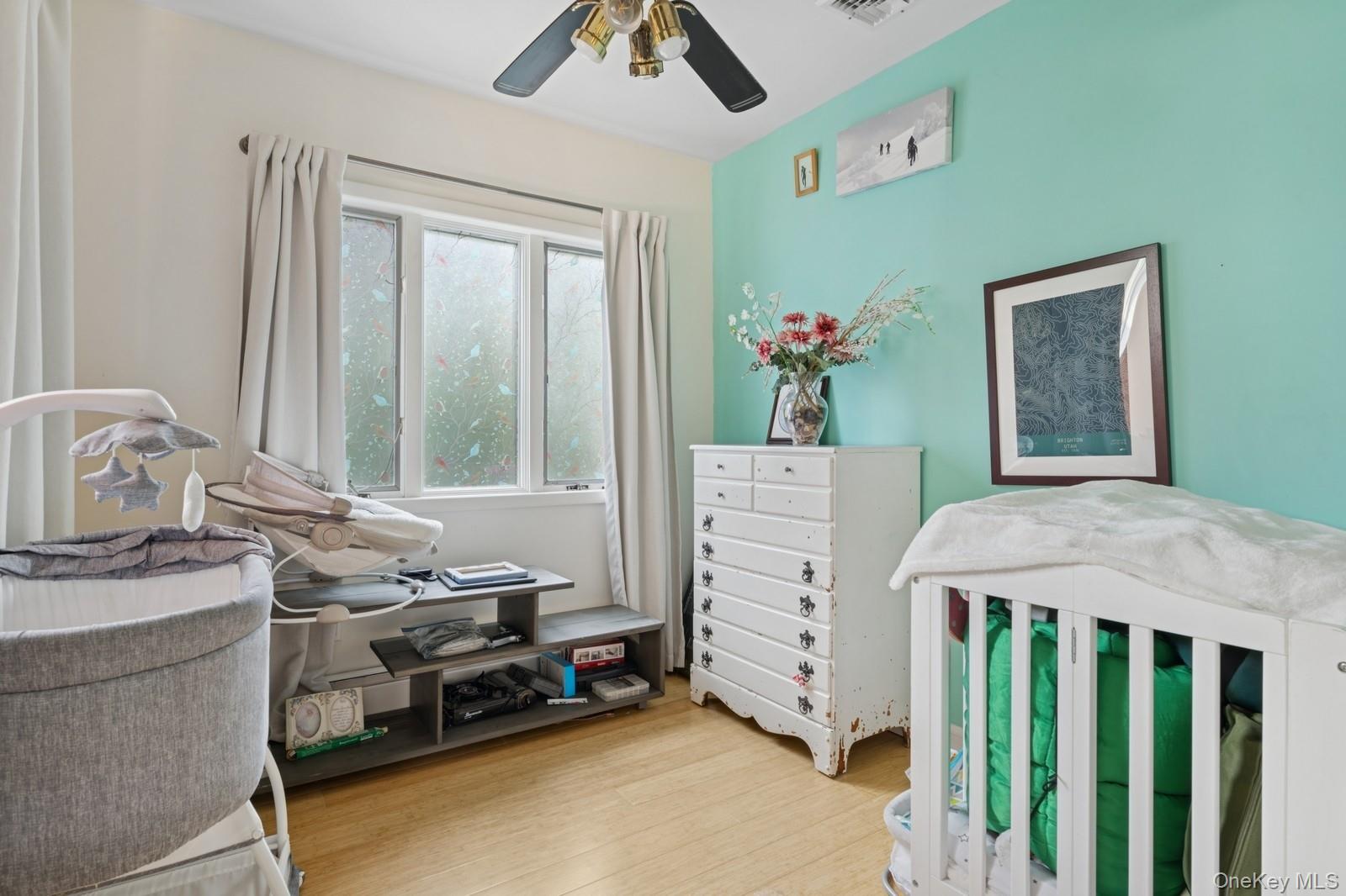 101 Bay Street Long Beach, NY 11561 - Photo 25 of 42 a bedroom that has a bed and a window