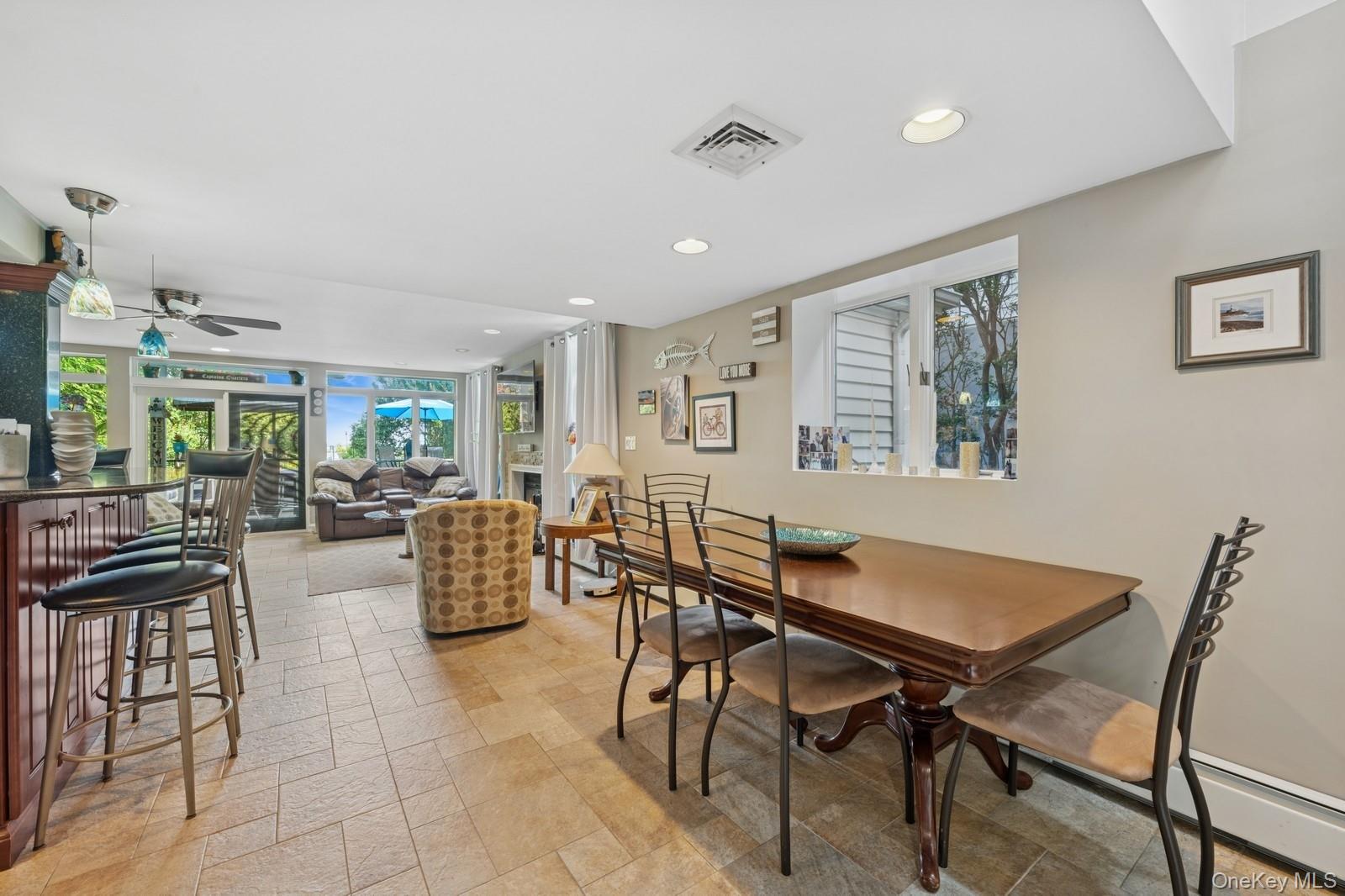 101 Bay Street Long Beach, NY 11561 - Photo 8 of 42 a view of a dining room with furniture and a potted plant