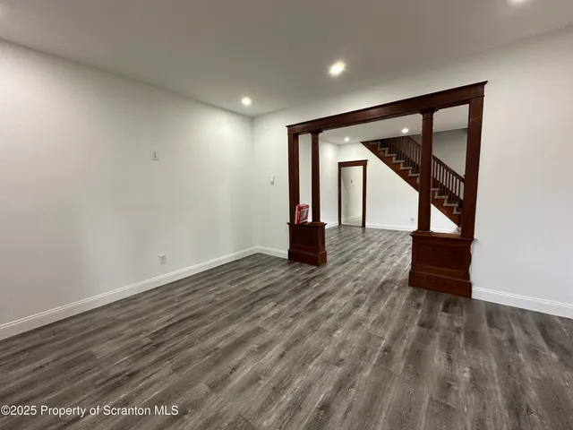 a view of entryway with wooden floor