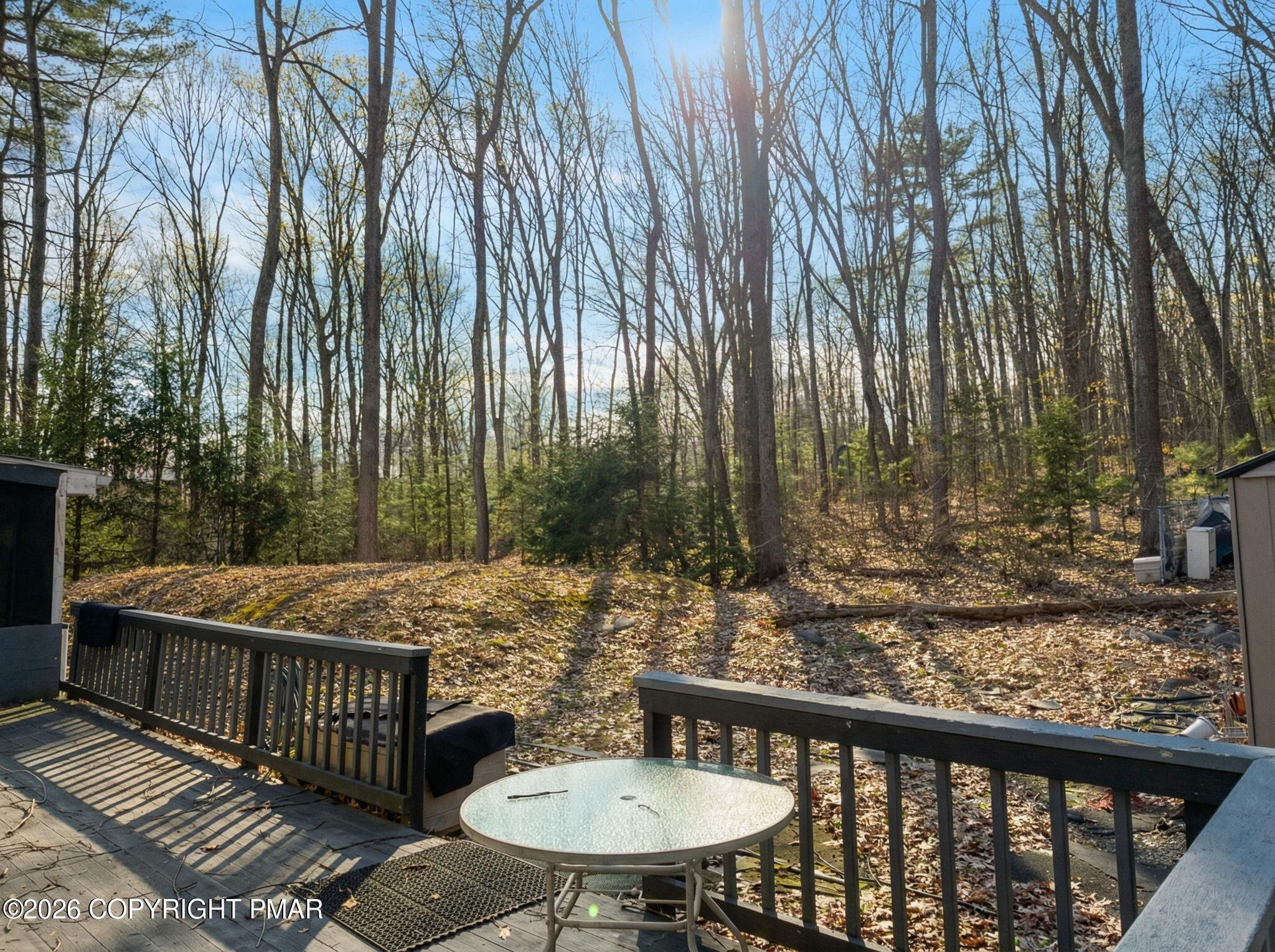 1208 Mattioli Road Bartonsville, PA 18321 - Photo 17 of 23 a view of a patio with table and chairs with wooden fence