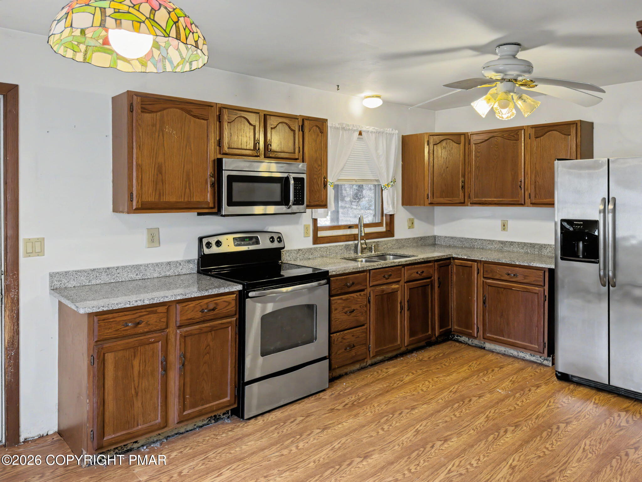 1208 Mattioli Road Bartonsville, PA 18321 - Photo 7 of 23 a kitchen with a sink cabinets and stainless steel appliances