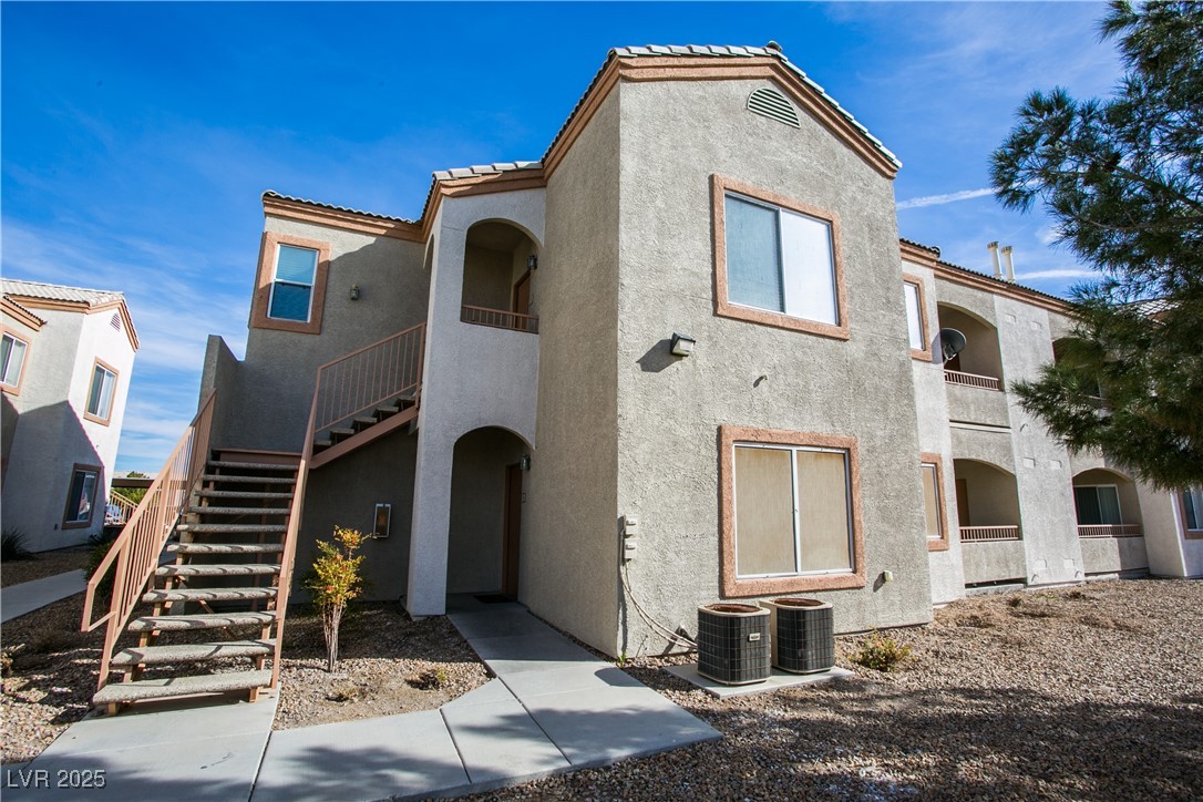 View of property featuring stairway