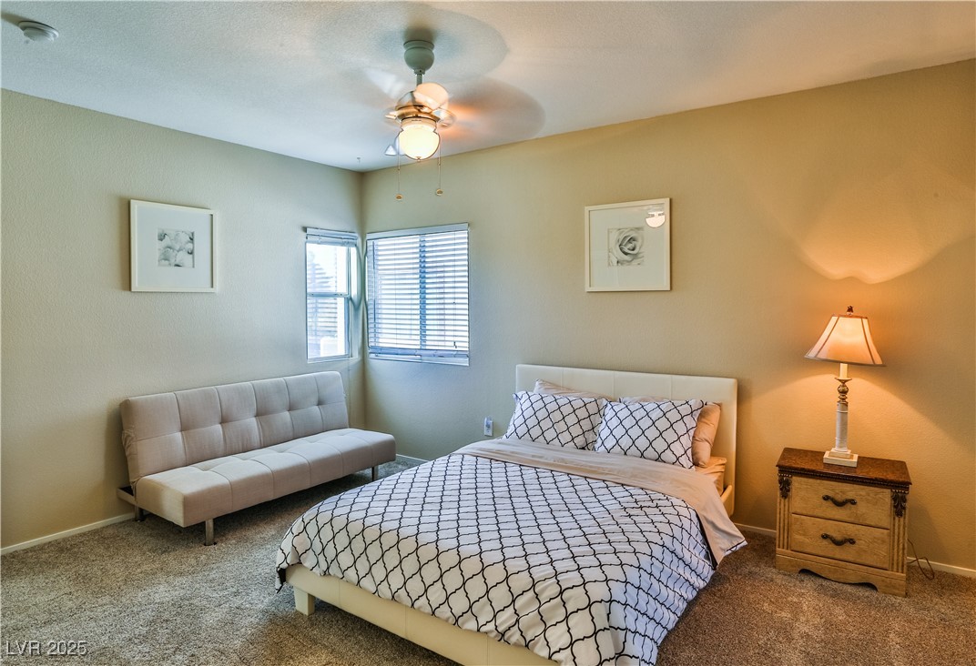 4655 Gold Dust Avenue, Unit 206 Las Vegas, NV 89120 - Photo 19 of 34 Bedroom with carpet floors and a ceiling fan
