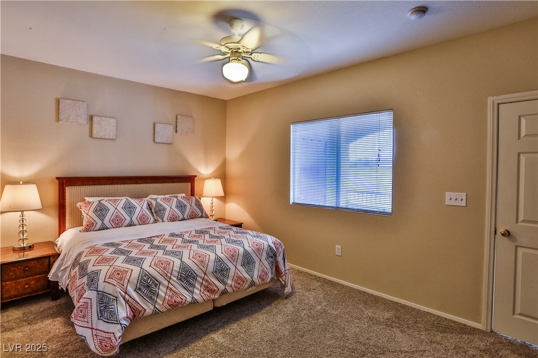 4655 Gold Dust Avenue, Unit 206 Las Vegas, NV 89120 - Photo 24 of 34 Bedroom featuring carpet and ceiling fan