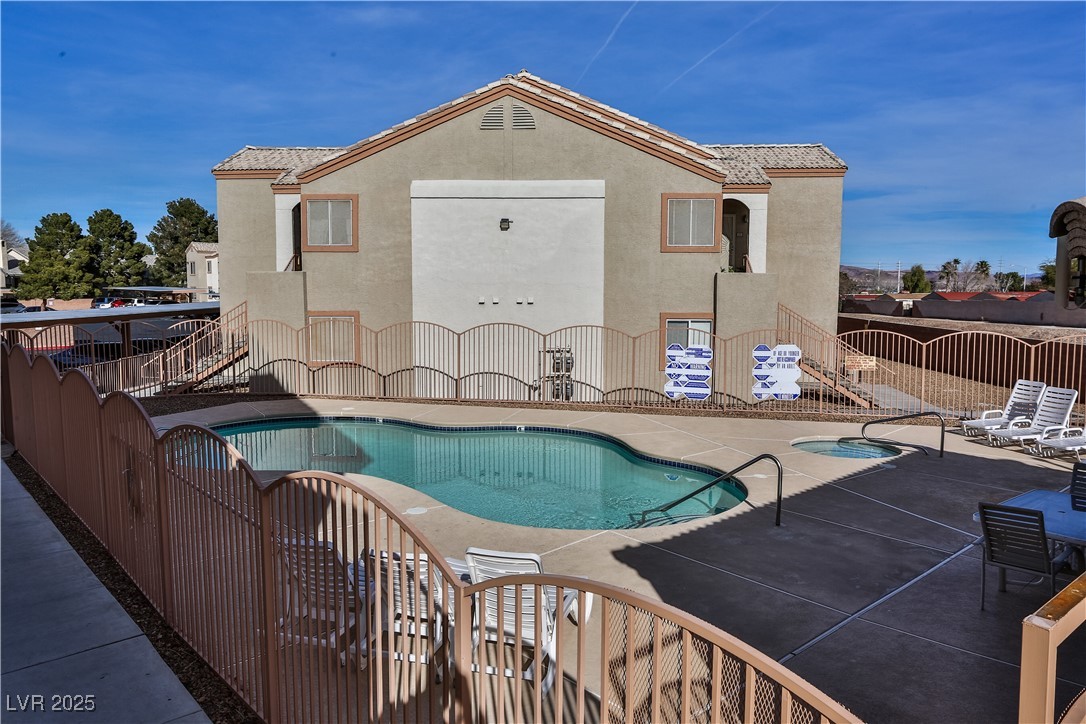 4655 Gold Dust Avenue, Unit 206 Las Vegas, NV 89120 - Photo 30 of 34 Community pool featuring a patio