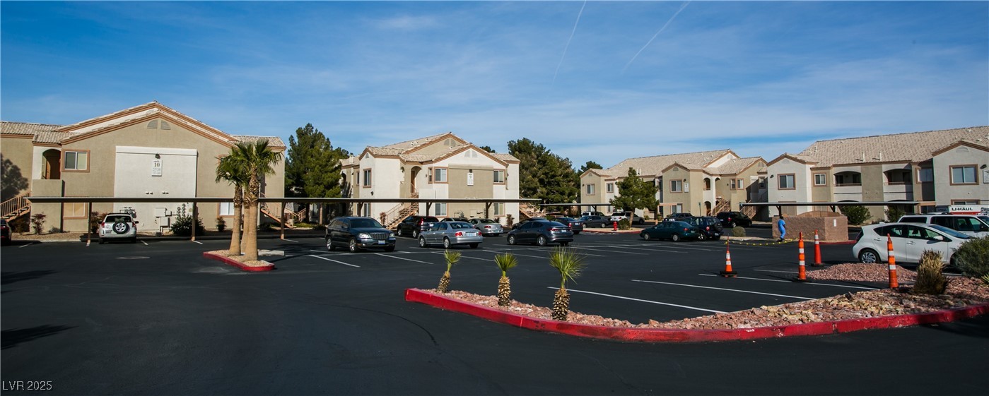 4655 Gold Dust Avenue, Unit 206 Las Vegas, NV 89120 - Photo 34 of 34 Uncovered parking lot featuring a residential view