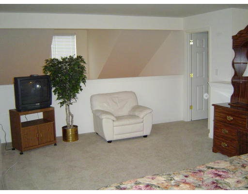 38 Brookview Road, Unit 38 Windham, NH 03087 - Photo 12 of 17 a living room with furniture and a flat screen tv
