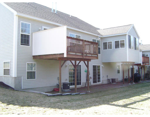 38 Brookview Road, Unit 38 Windham, NH 03087 - Photo 13 of 17 a view of a house with backyard and plants
