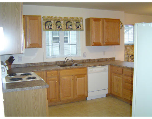 38 Brookview Road, Unit 38 Windham, NH 03087 - Photo 6 of 17 a kitchen with stainless steel appliances granite countertop a sink stove and cabinets