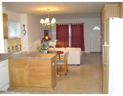38 Brookview Road, Unit 38 Windham, NH 03087 - Photo 7 of 17 a dining room with furniture and chandelier