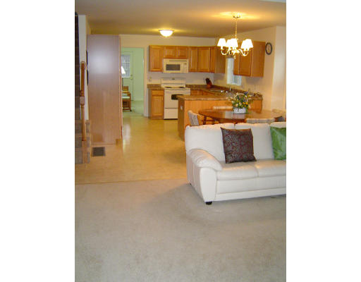 38 Brookview Road, Unit 38 Windham, NH 03087 - Photo 8 of 17 a view of kitchen with living room and couch