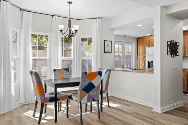 a dining room with furniture and window