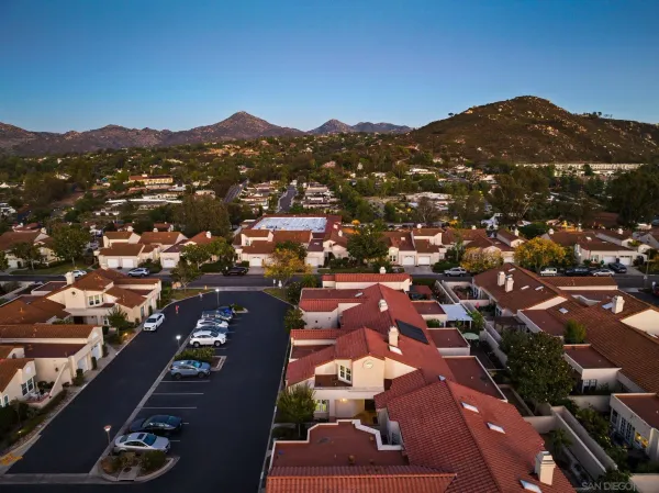 an aerial view of residential houses with outdoor space
