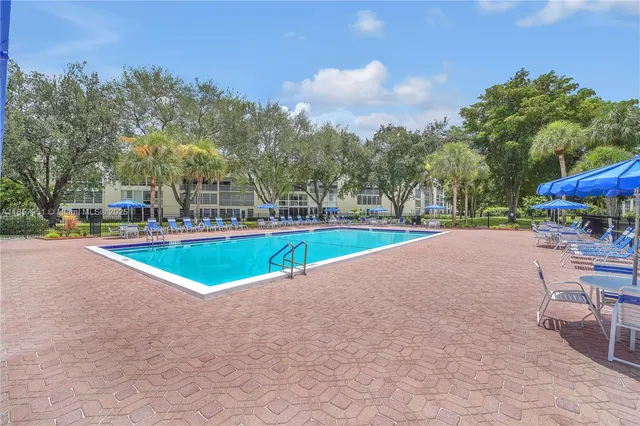 a view of outdoor space with playground and green space