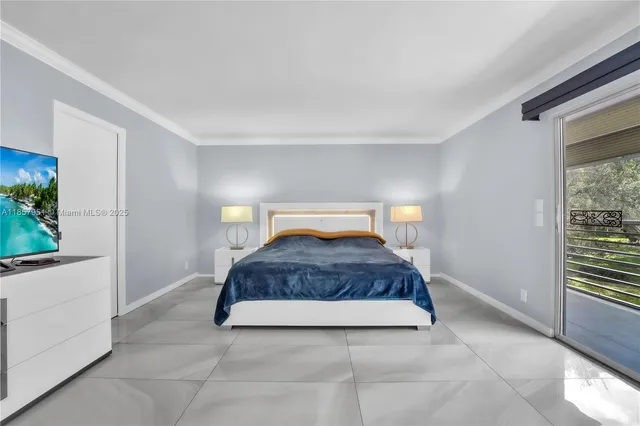 a bedroom with a bed and a potted plant