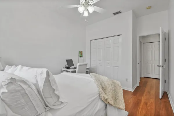 a bed room with a bed and a chandelier