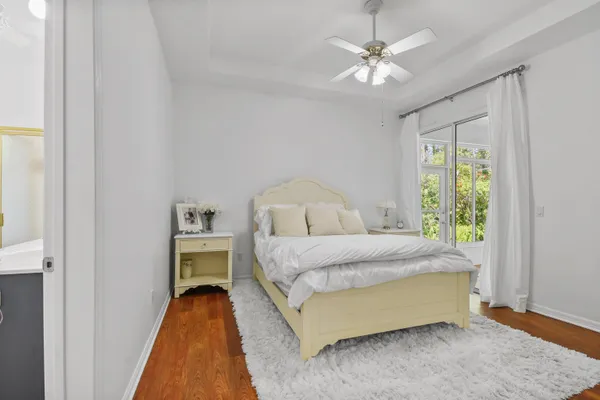 a spacious bedroom with a bed and a window