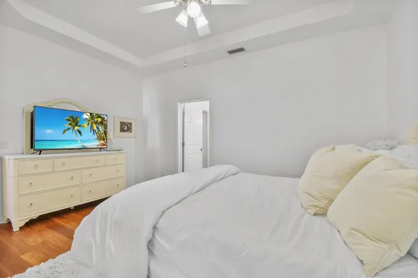 a bedroom with a bed and a dresser