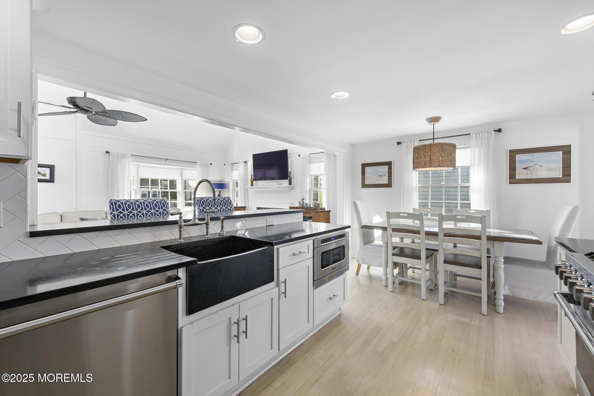 9 Inlet Road Beach Haven, NJ 08008 - Photo 11 of 51 a kitchen with stainless steel appliances kitchen island granite countertop a sink and cabinets
