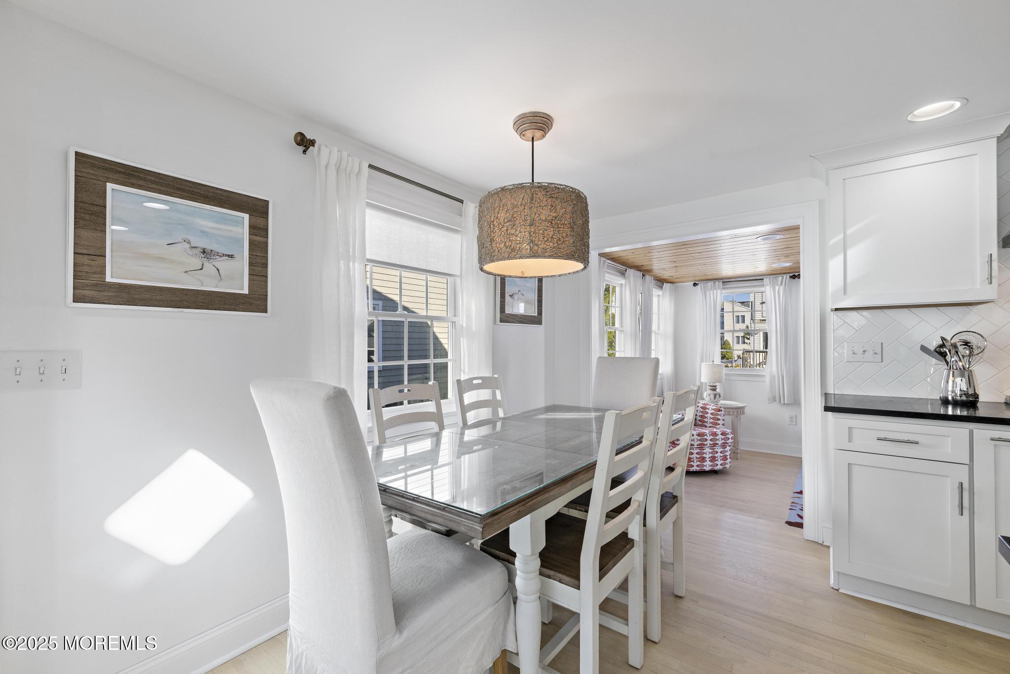 9 Inlet Road Beach Haven, NJ 08008 - Photo 12 of 51 a view of a dining room with furniture and wooden floor
