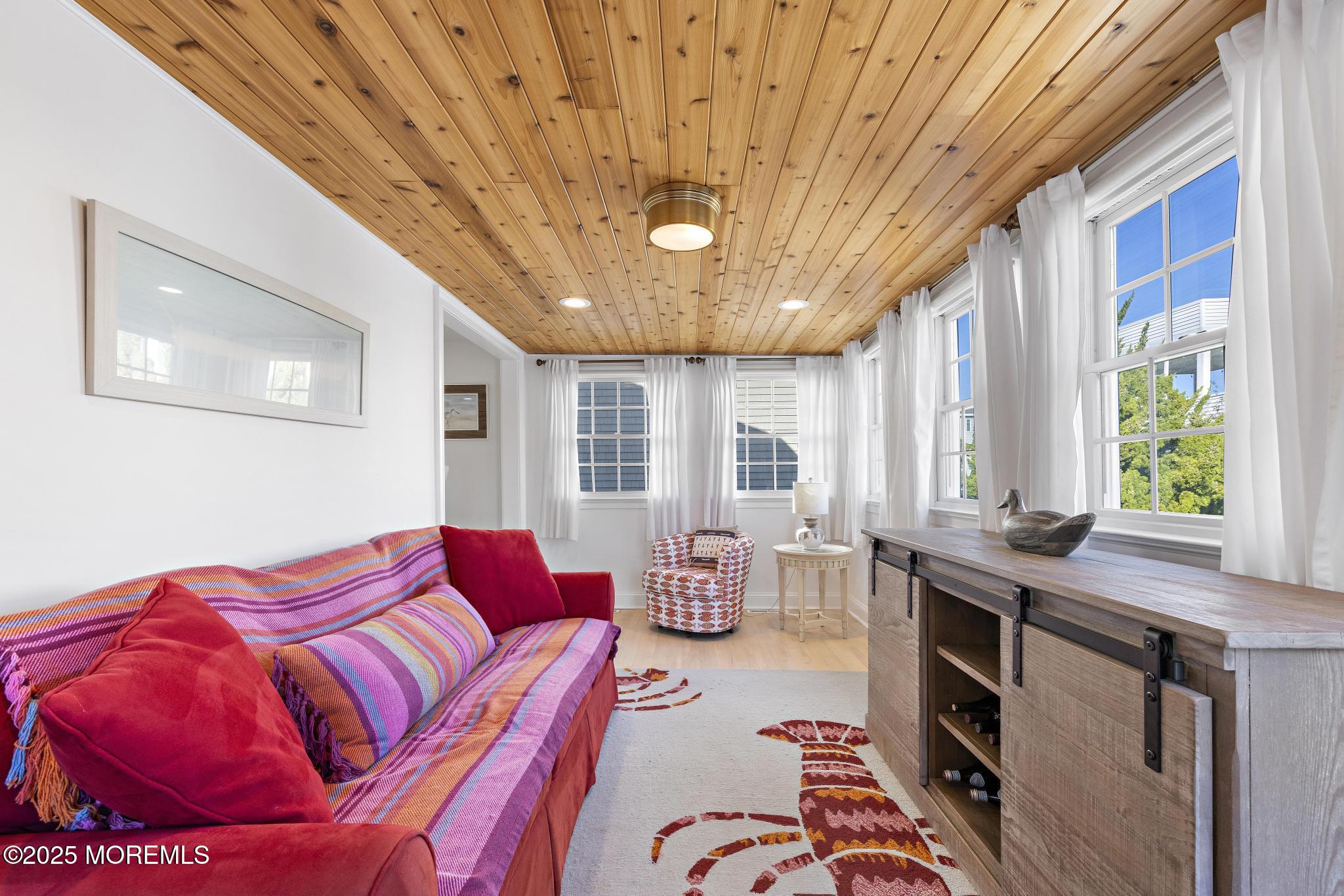 9 Inlet Road Beach Haven, NJ 08008 - Photo 13 of 51 a bedroom with furniture and windows