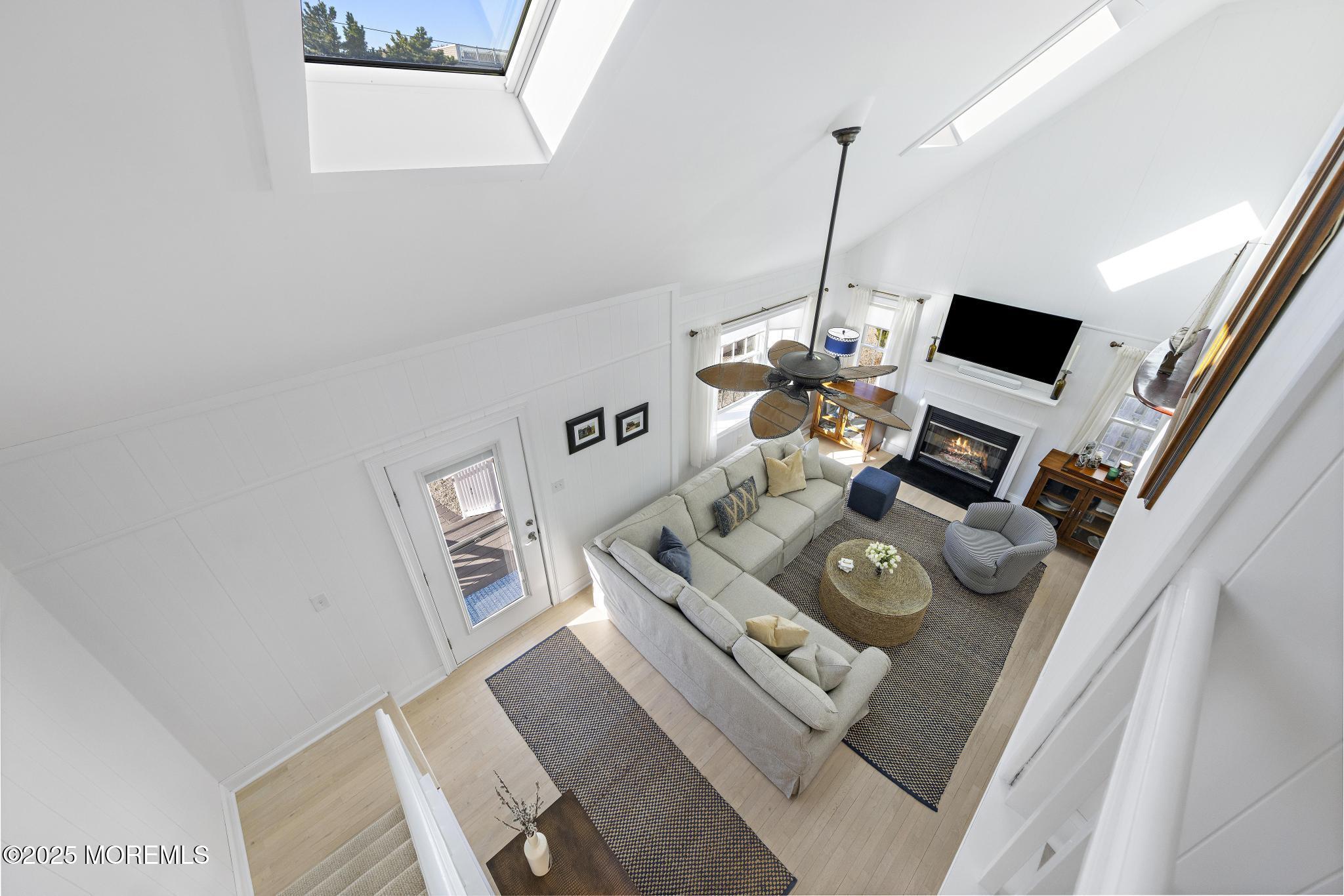 9 Inlet Road Beach Haven, NJ 08008 - Photo 16 of 51 a living room with furniture and a flat screen tv